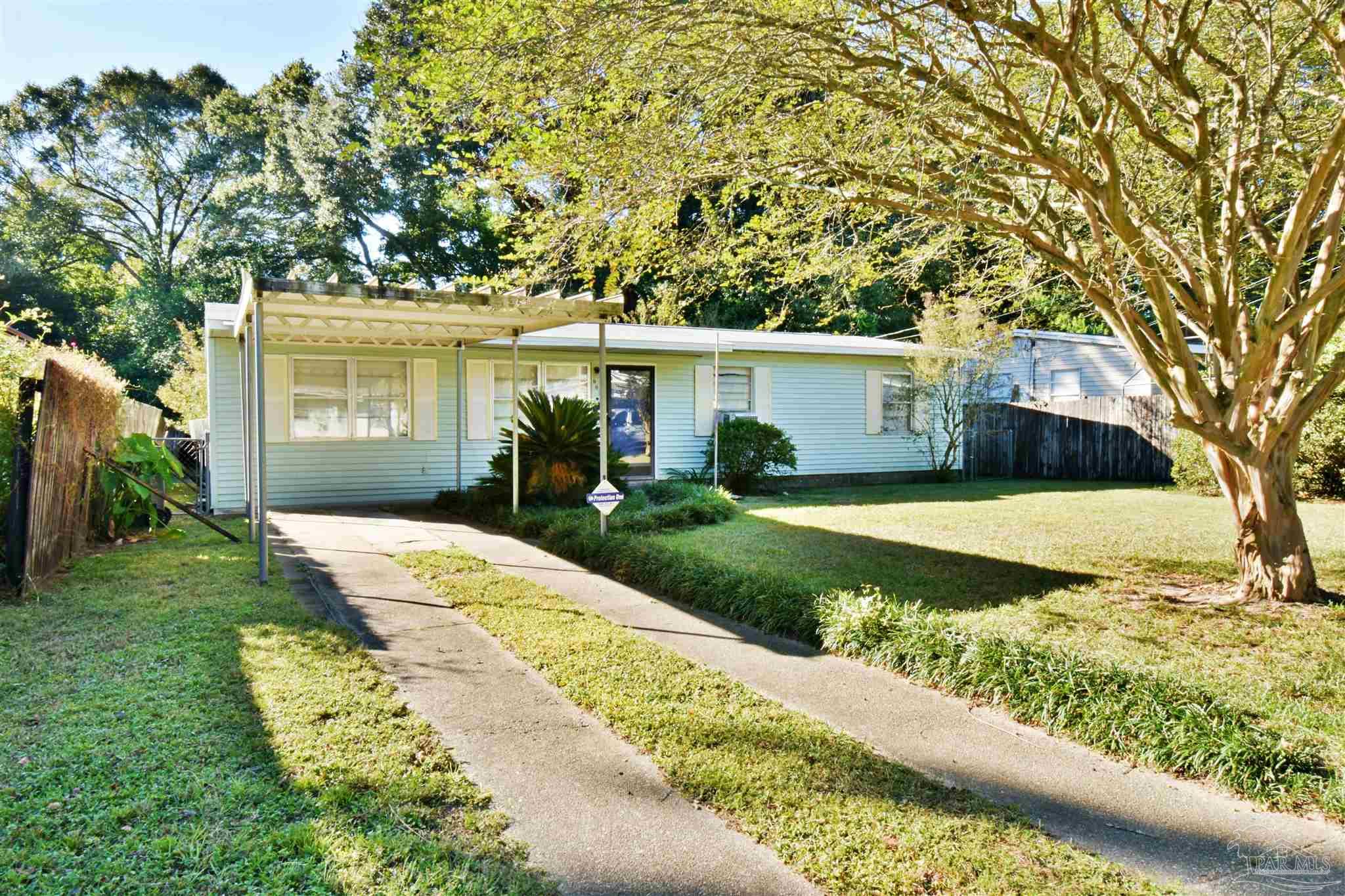 front view of a house with a yard