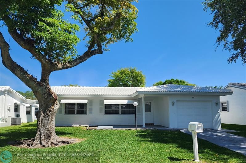 a front view of house with yard