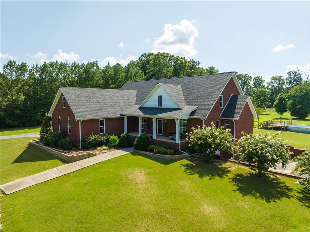 a front view of house with yard and green space