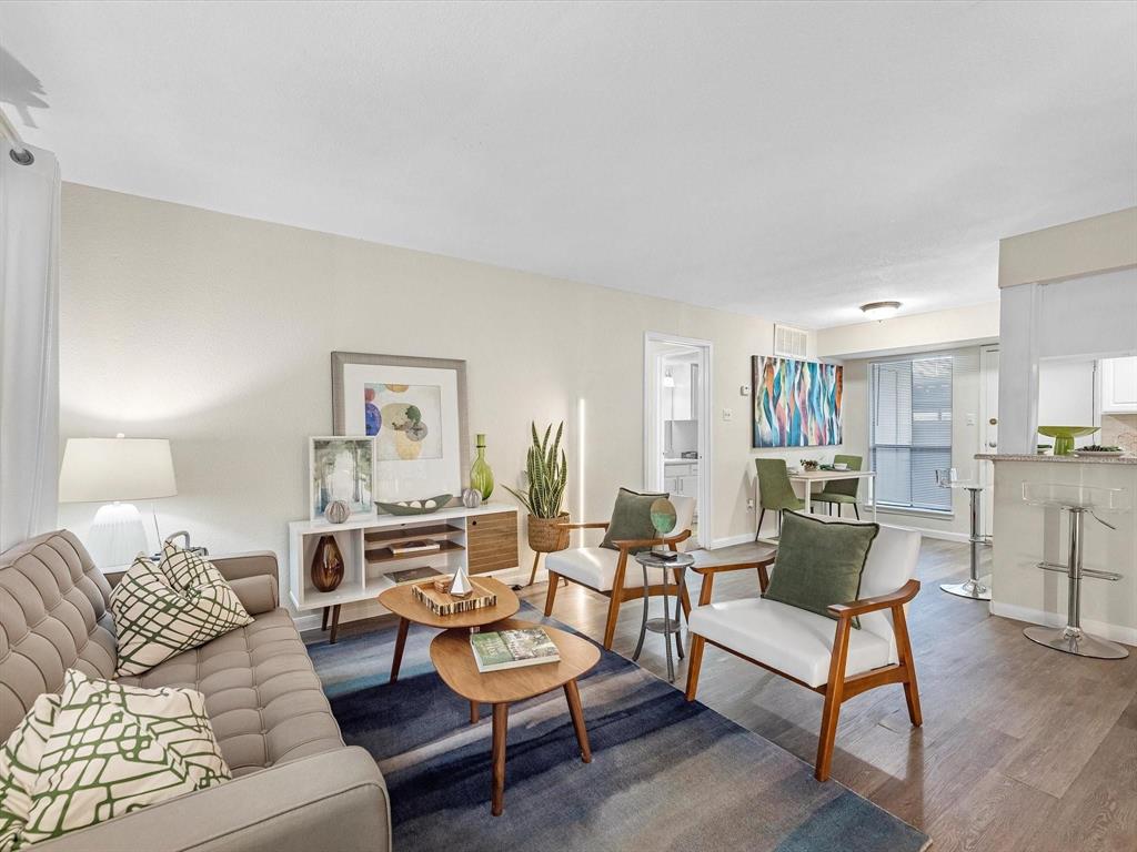 a living room with furniture and a table