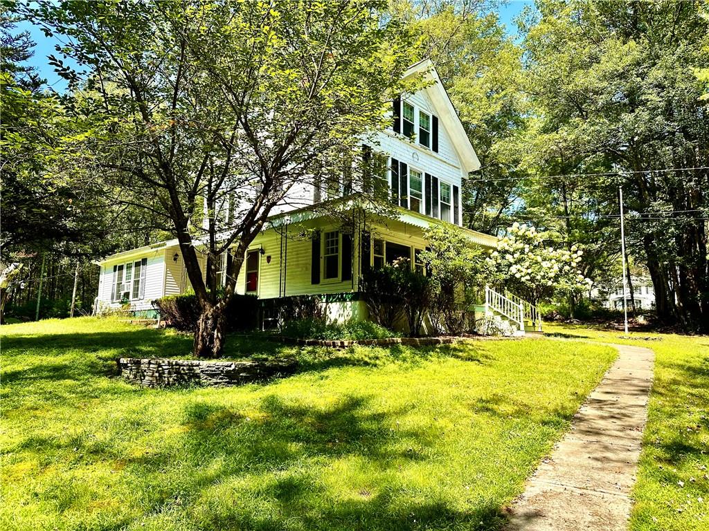 a front view of a house with a yard