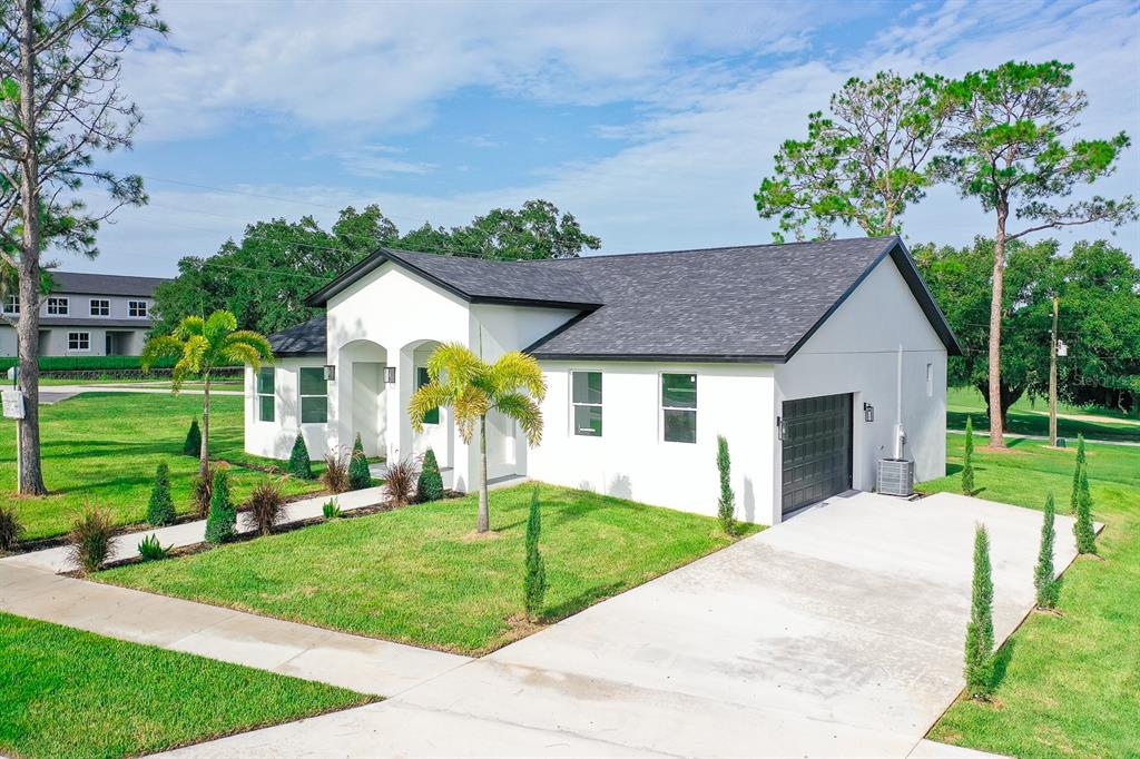 a front view of a house with garden