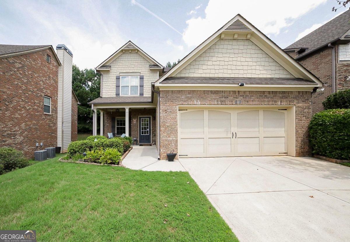 front view of a house with a yard