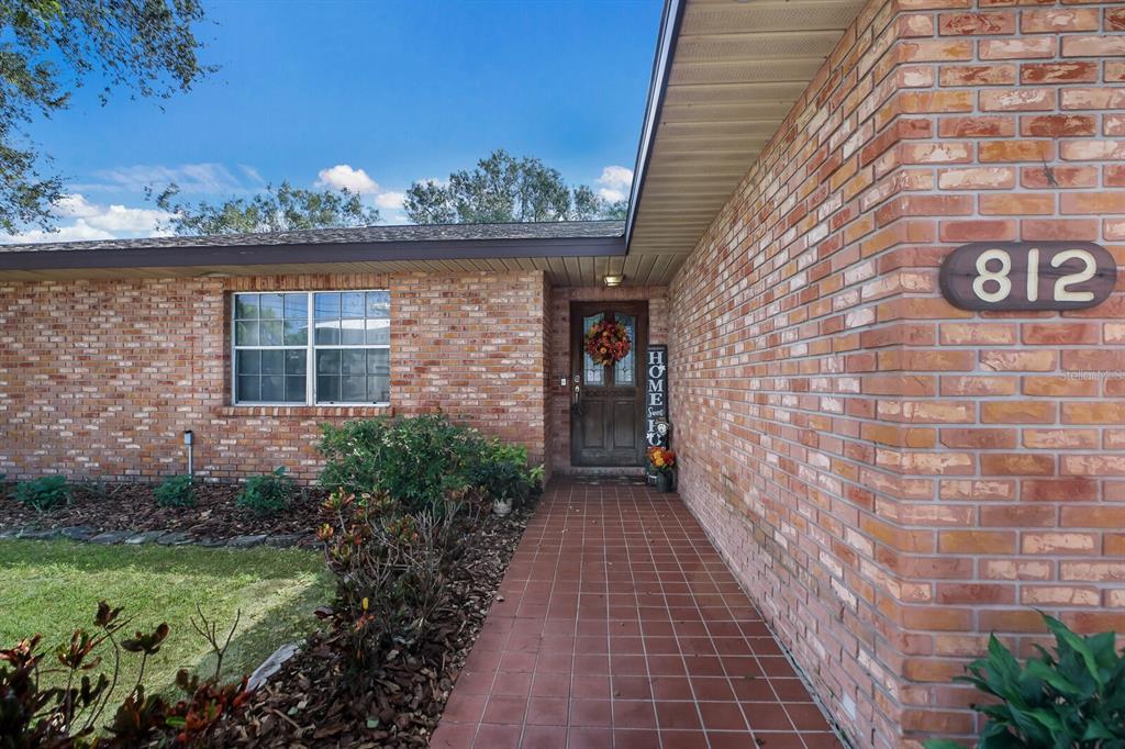 a view of a pathway both side of brick house