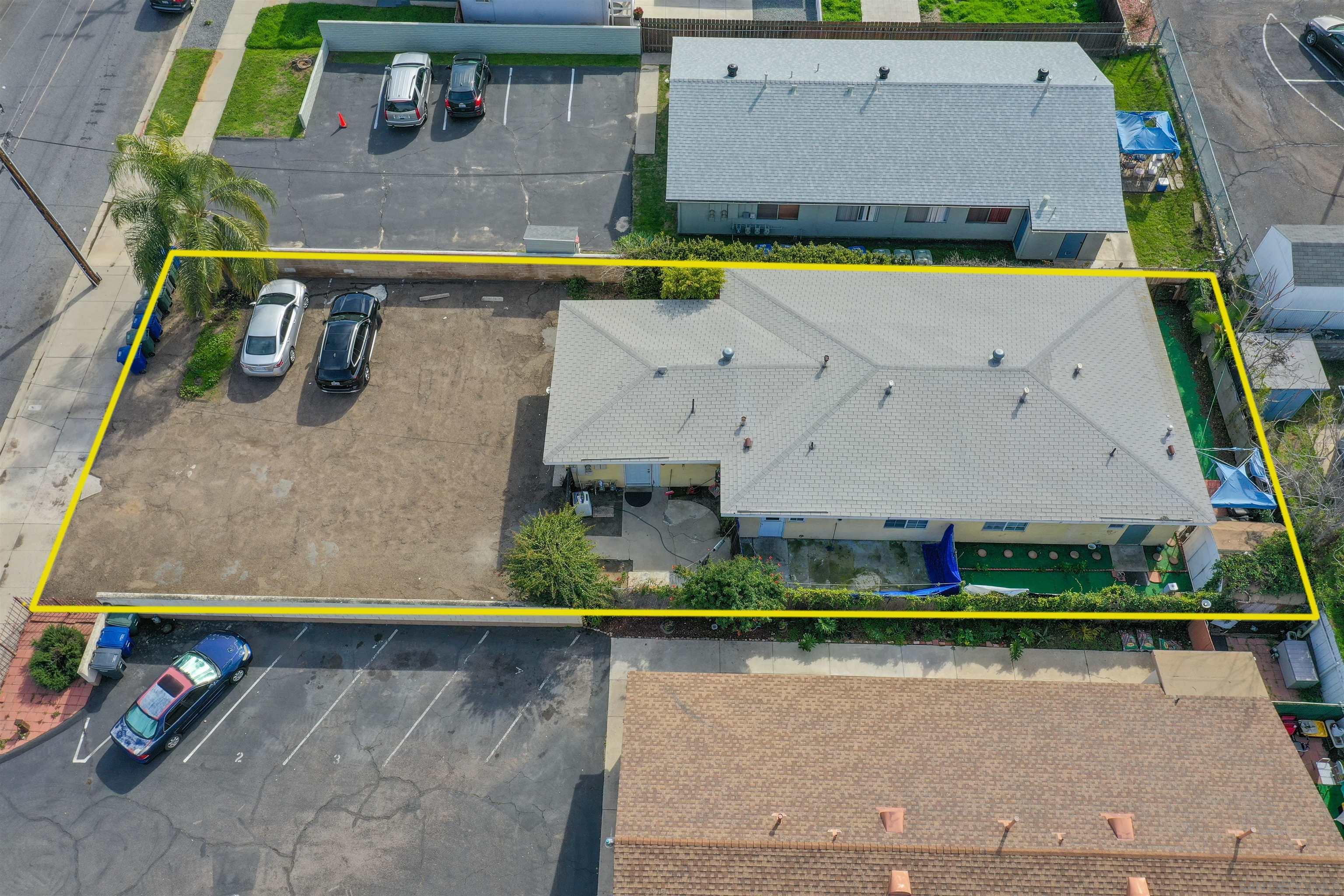 an aerial view of a house with a swimming pool