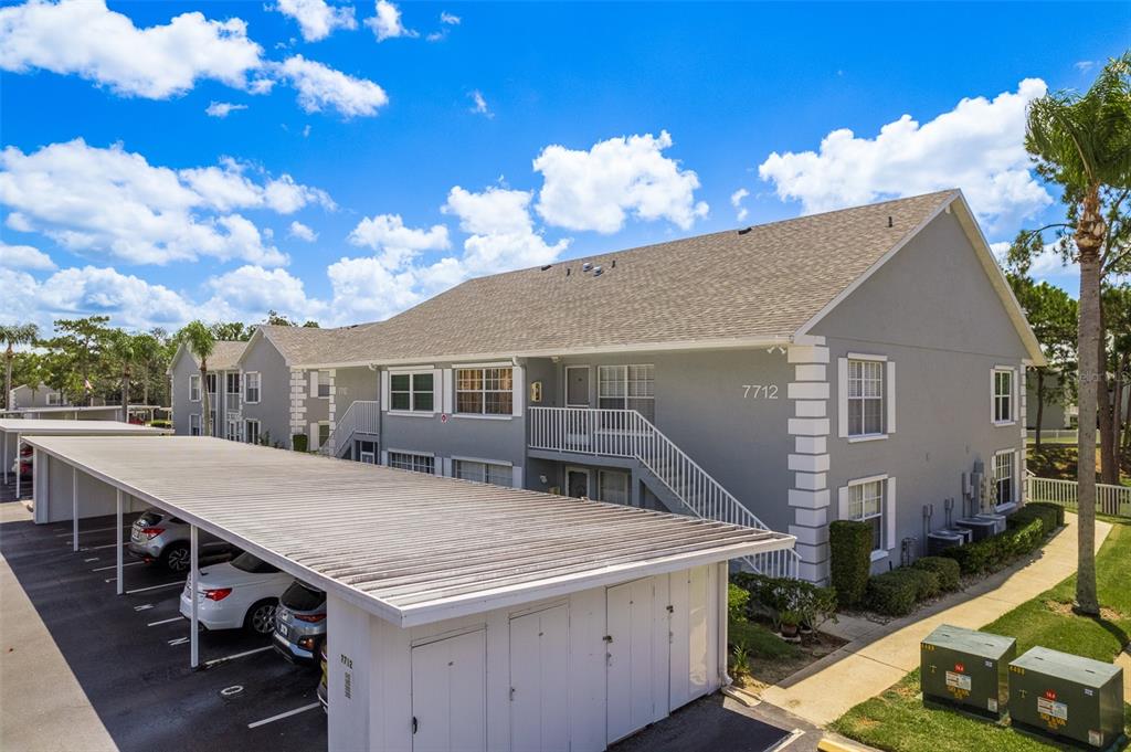 a aerial view of a house with roof deck front of house