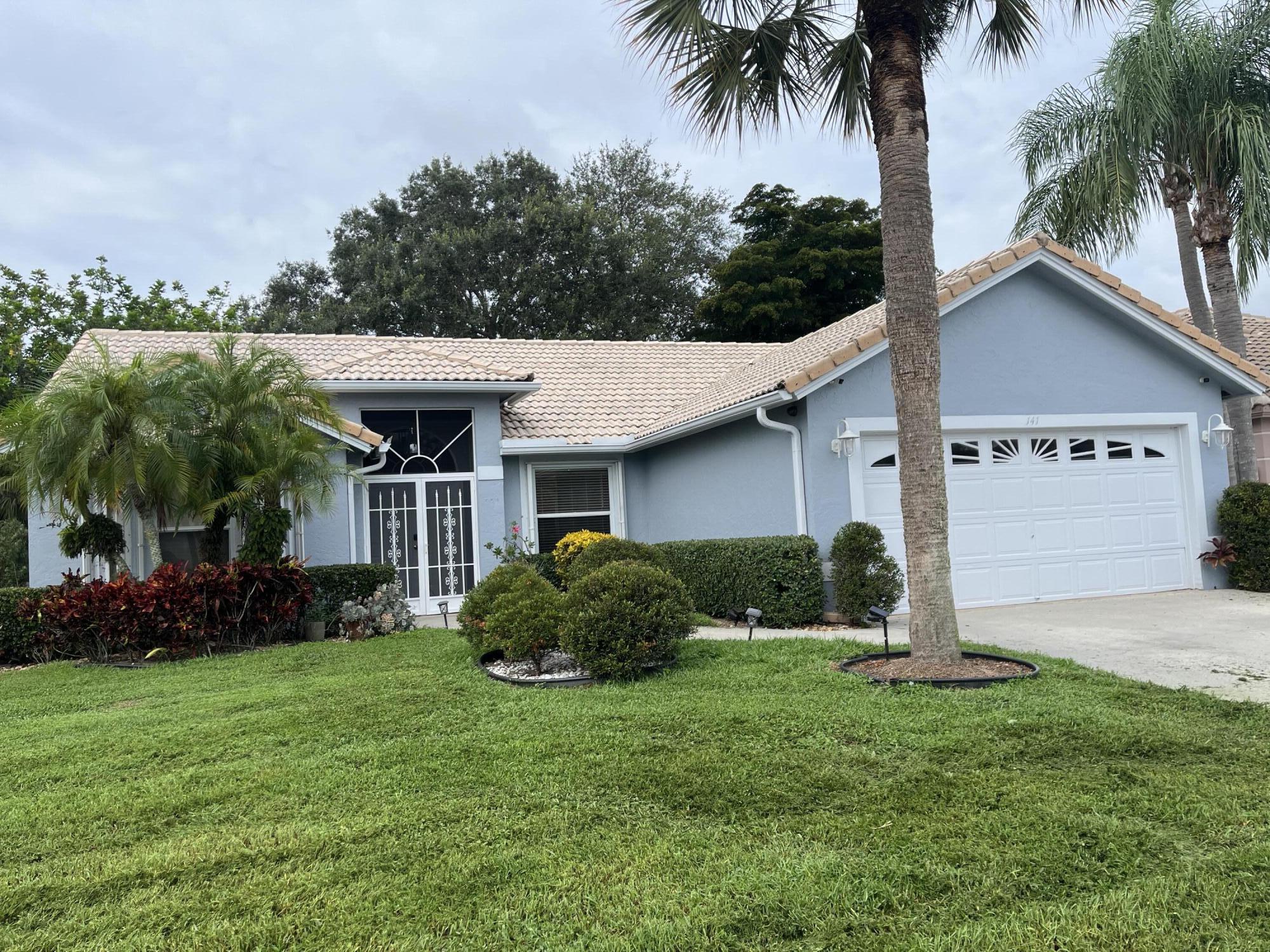 front view of a house with a yard