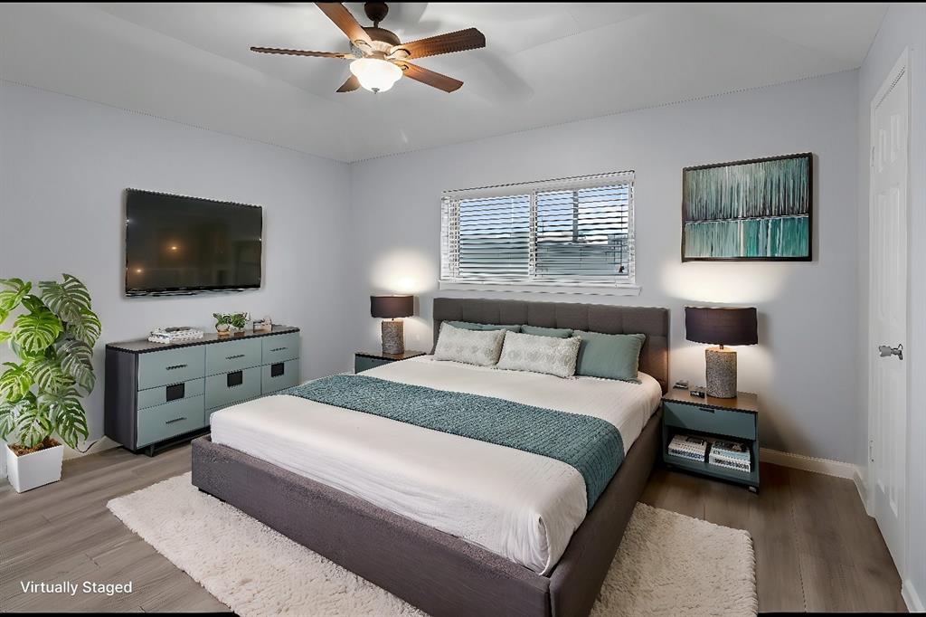 Virtually staged primary bedroom with plenty of natural light and room for furniture