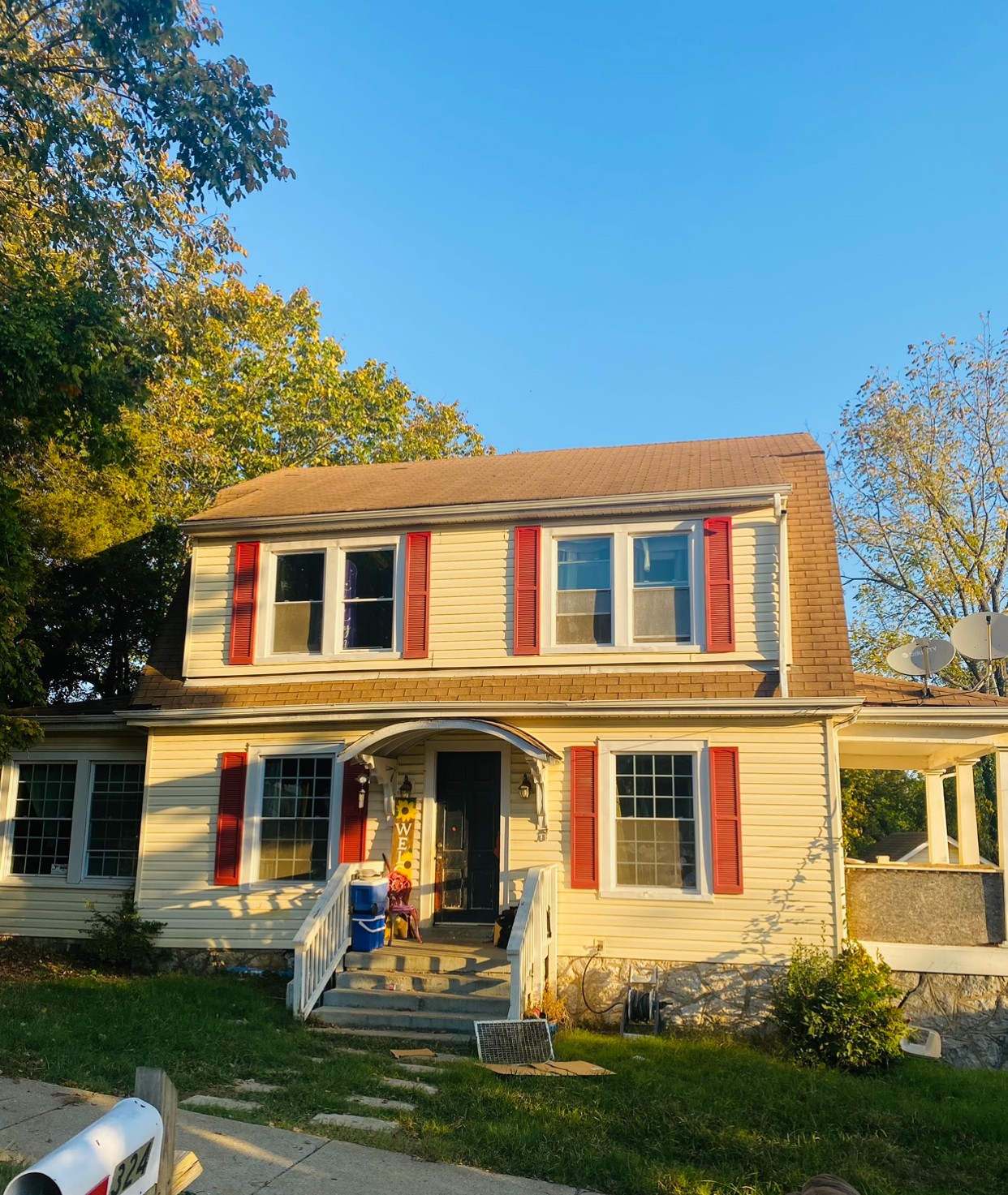 a front view of a house with garden