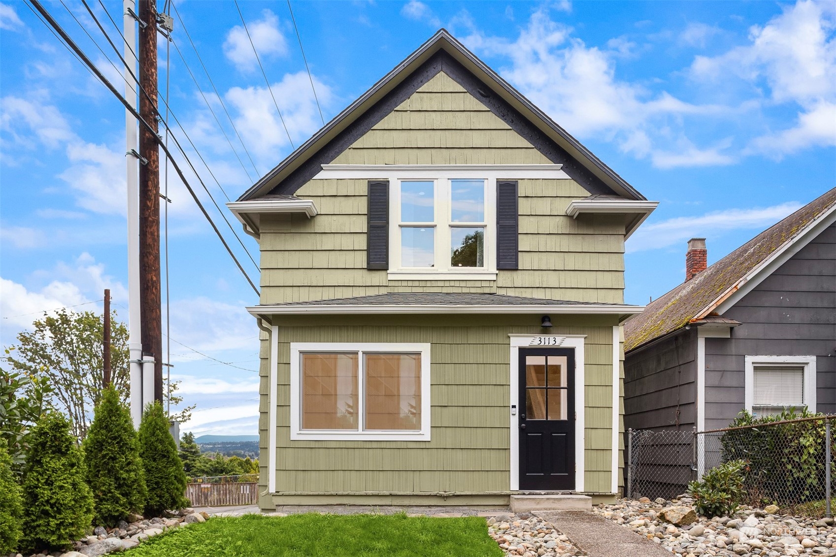 a front view of a house with garage