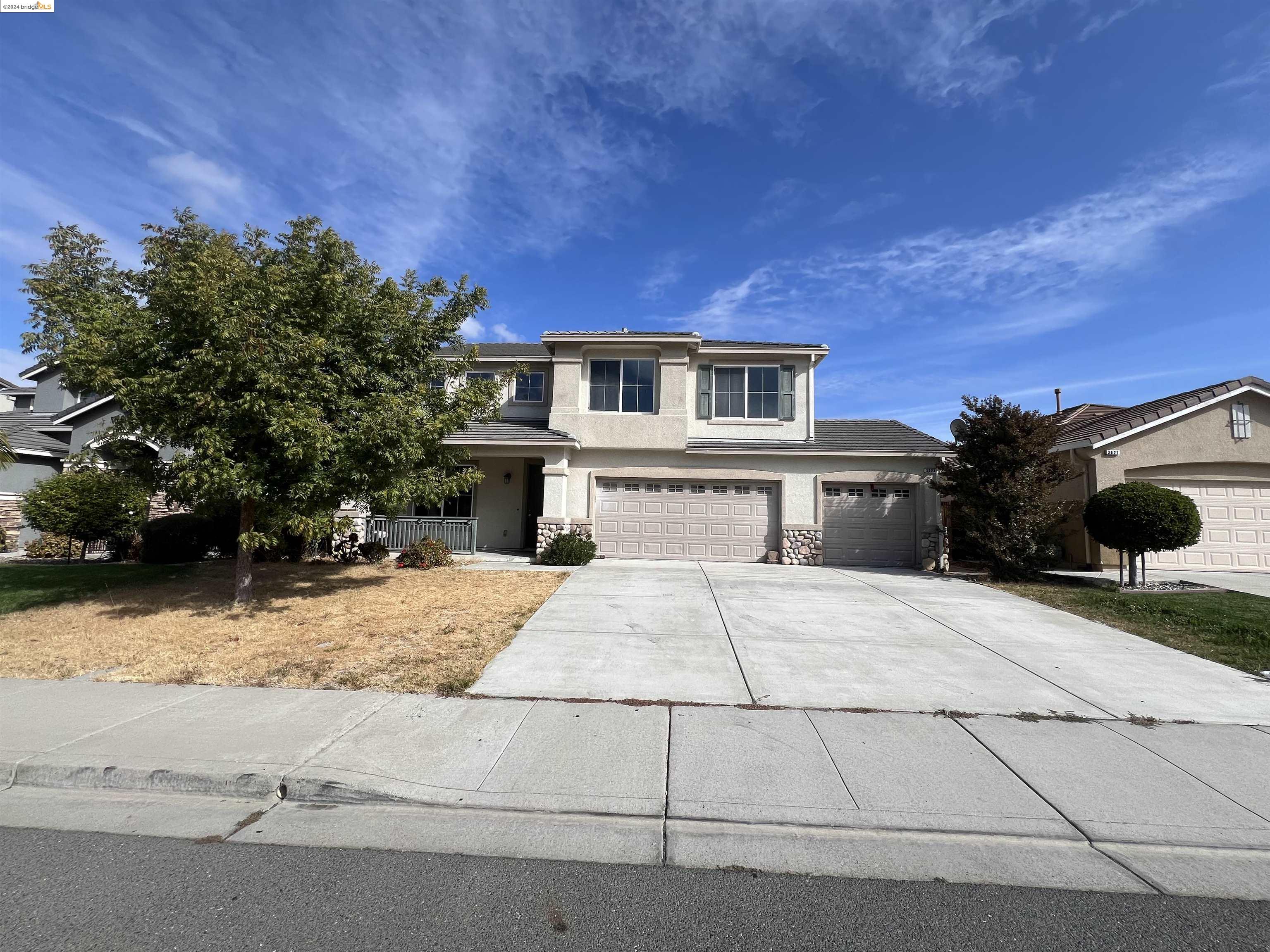 a house with trees in the background