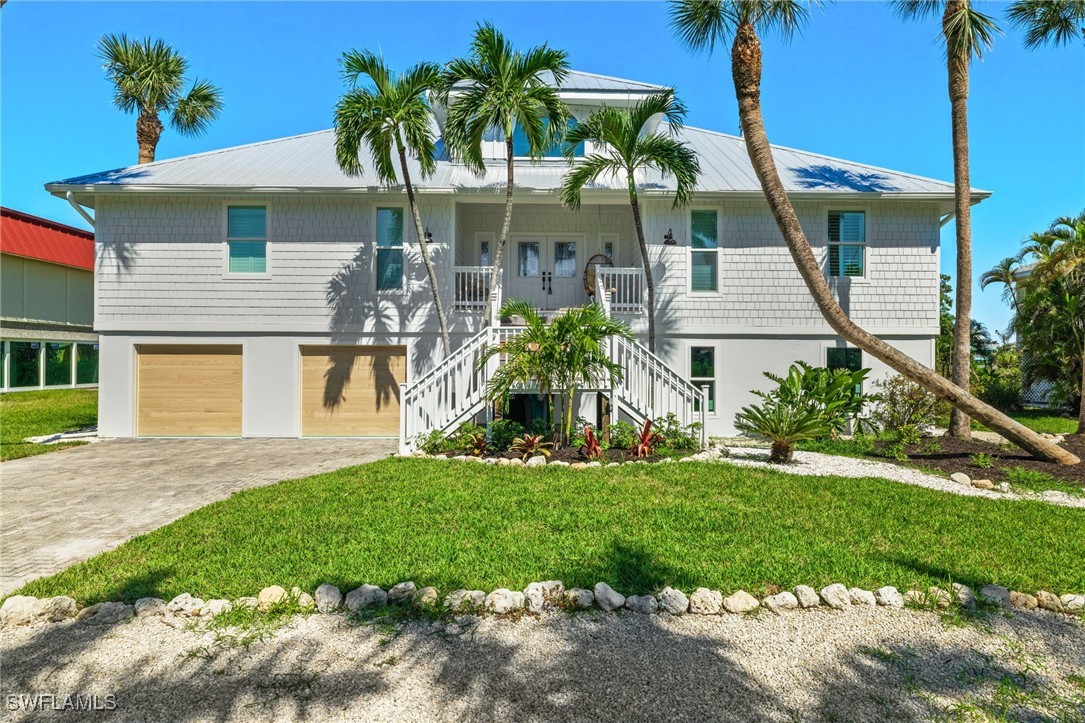 a front view of house with yard and green space