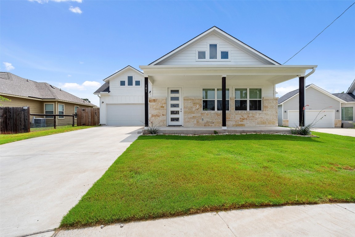 a front view of a house with garden