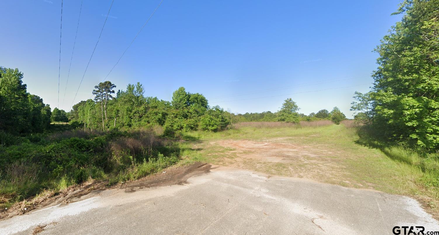 a view of a lake with a yard