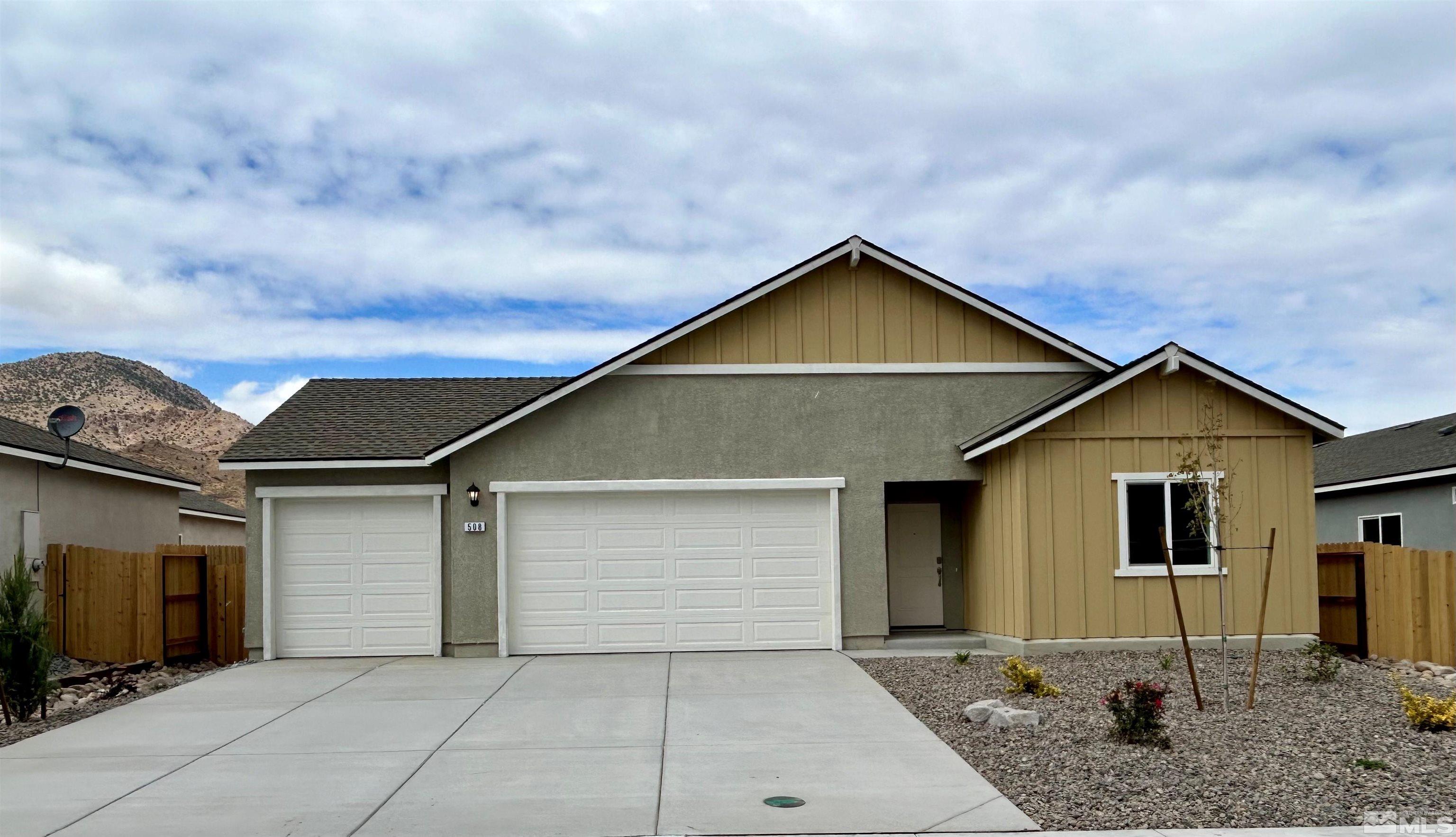 a front view of a house with garage