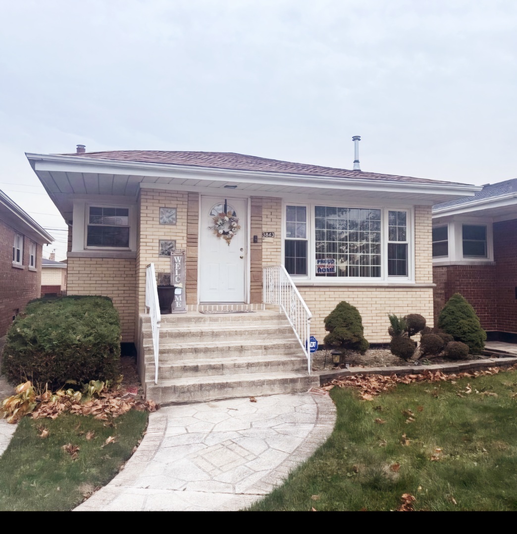 a front view of a house with sitting area