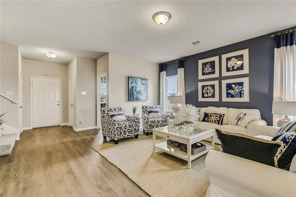 a living room with furniture and a table