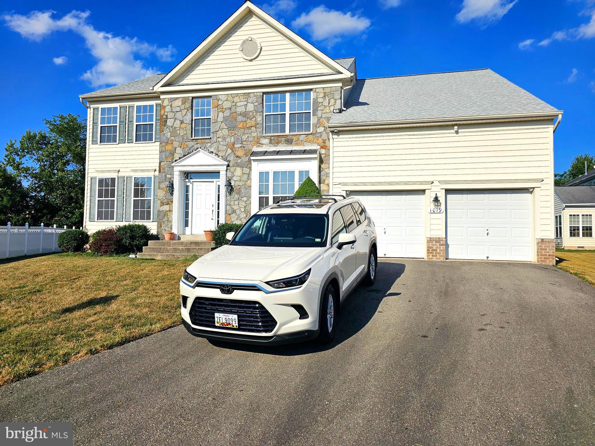 a car parked in front of a house