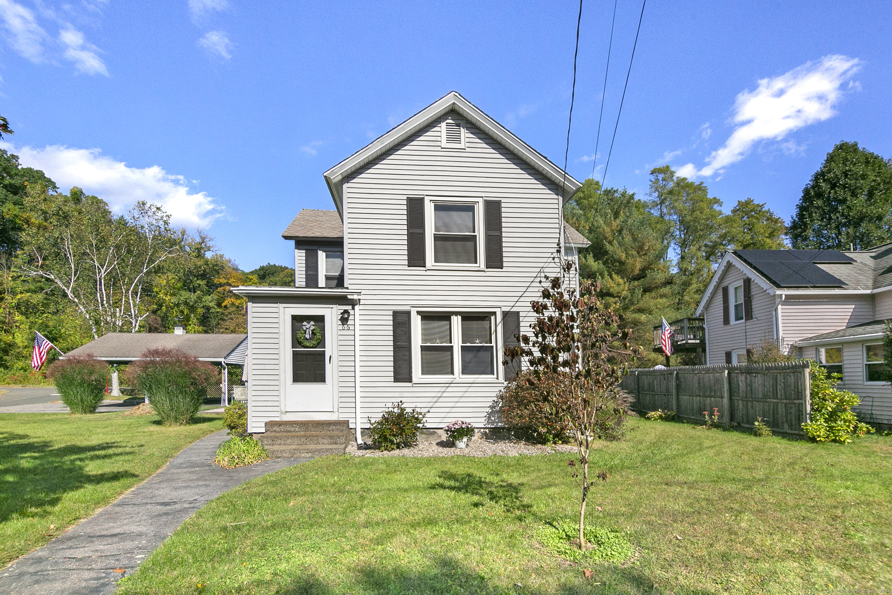 a front view of a house with a yard