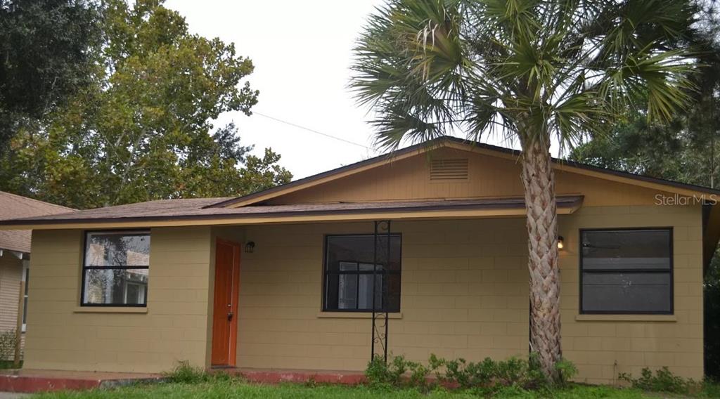 a front view of a house with garage