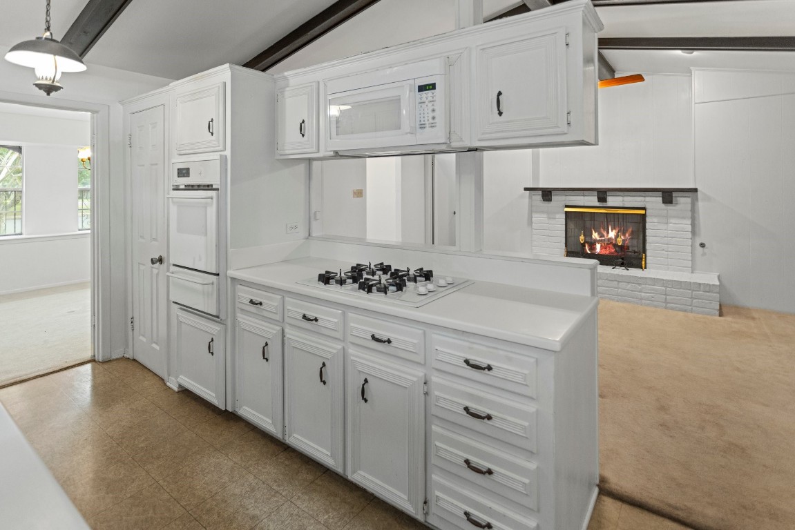 a kitchen with stainless steel appliances cabinets and a refrigerator