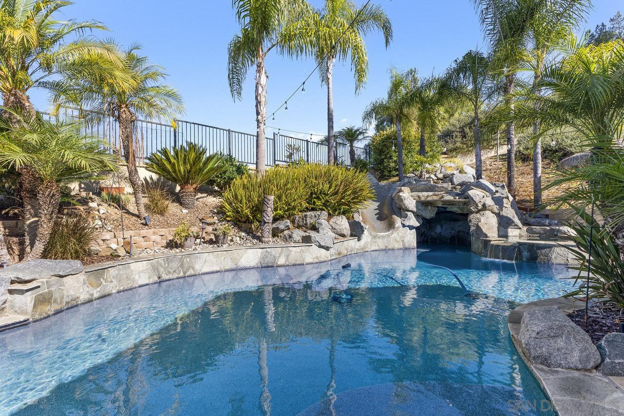 a view of swimming pool with a patio