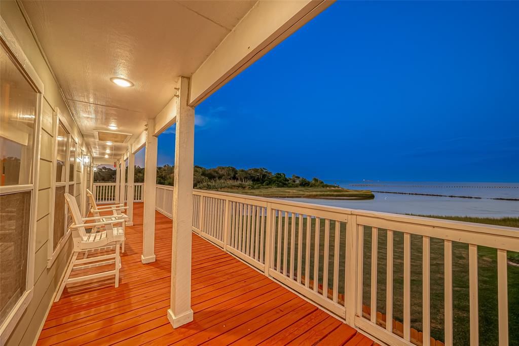 a view of balcony with wooden floor