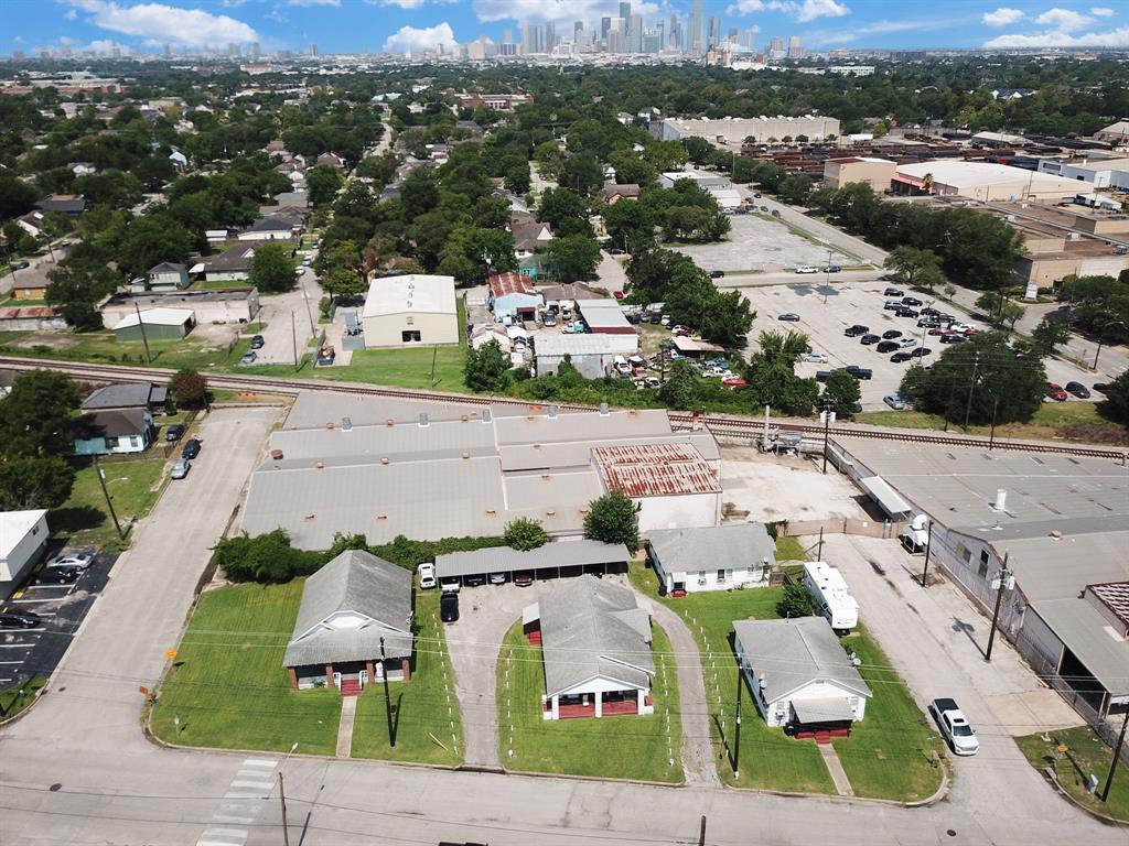 an aerial view of residential houses with outdoor space