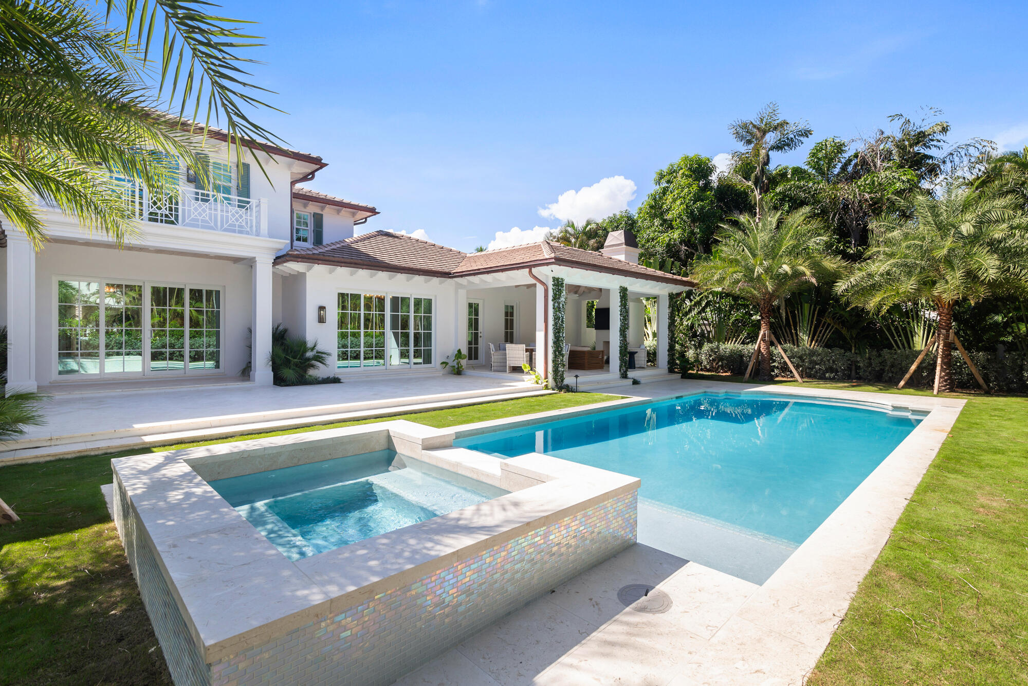 a view of a house with swimming pool and a porch