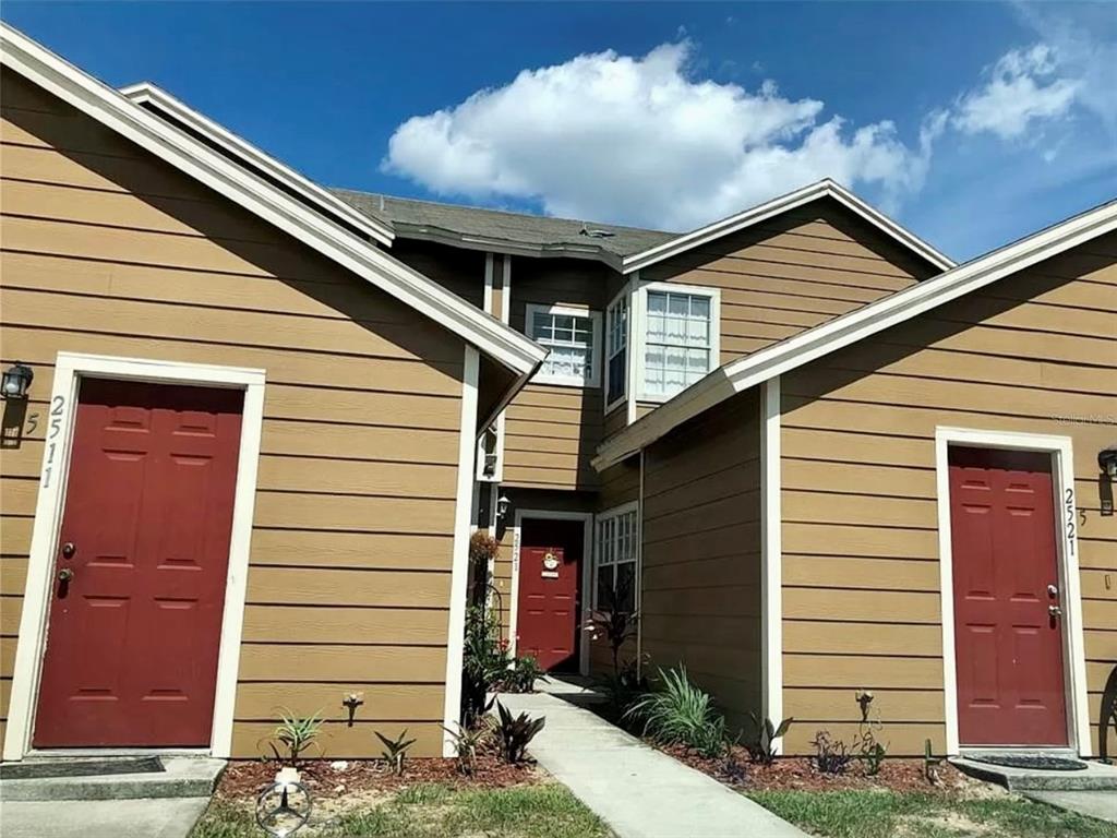 a view of a house with a yard