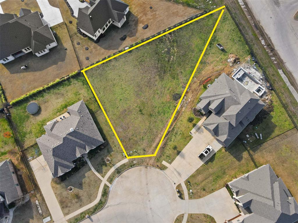 an aerial view of a house with a swimming pool