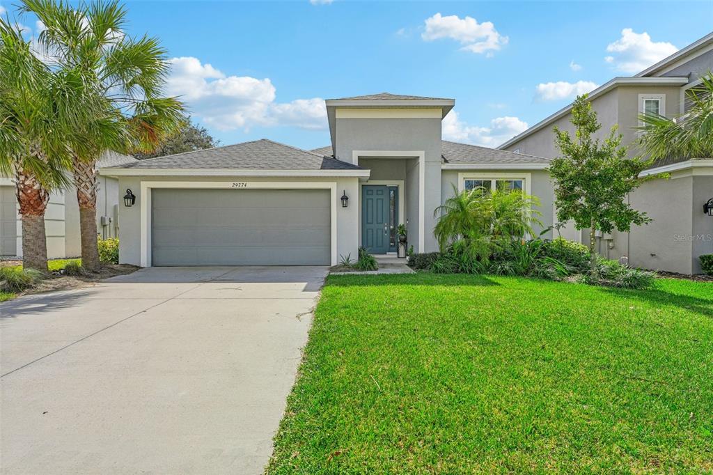 front view of a house with a yard