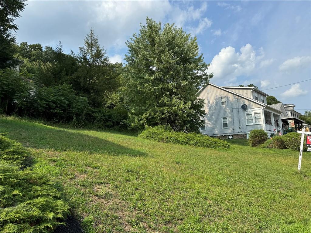 a view of a house with a big yard