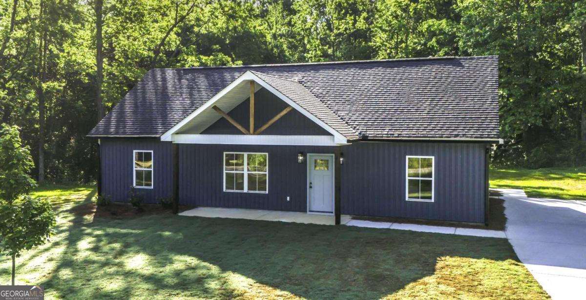 a front view of a house with a yard