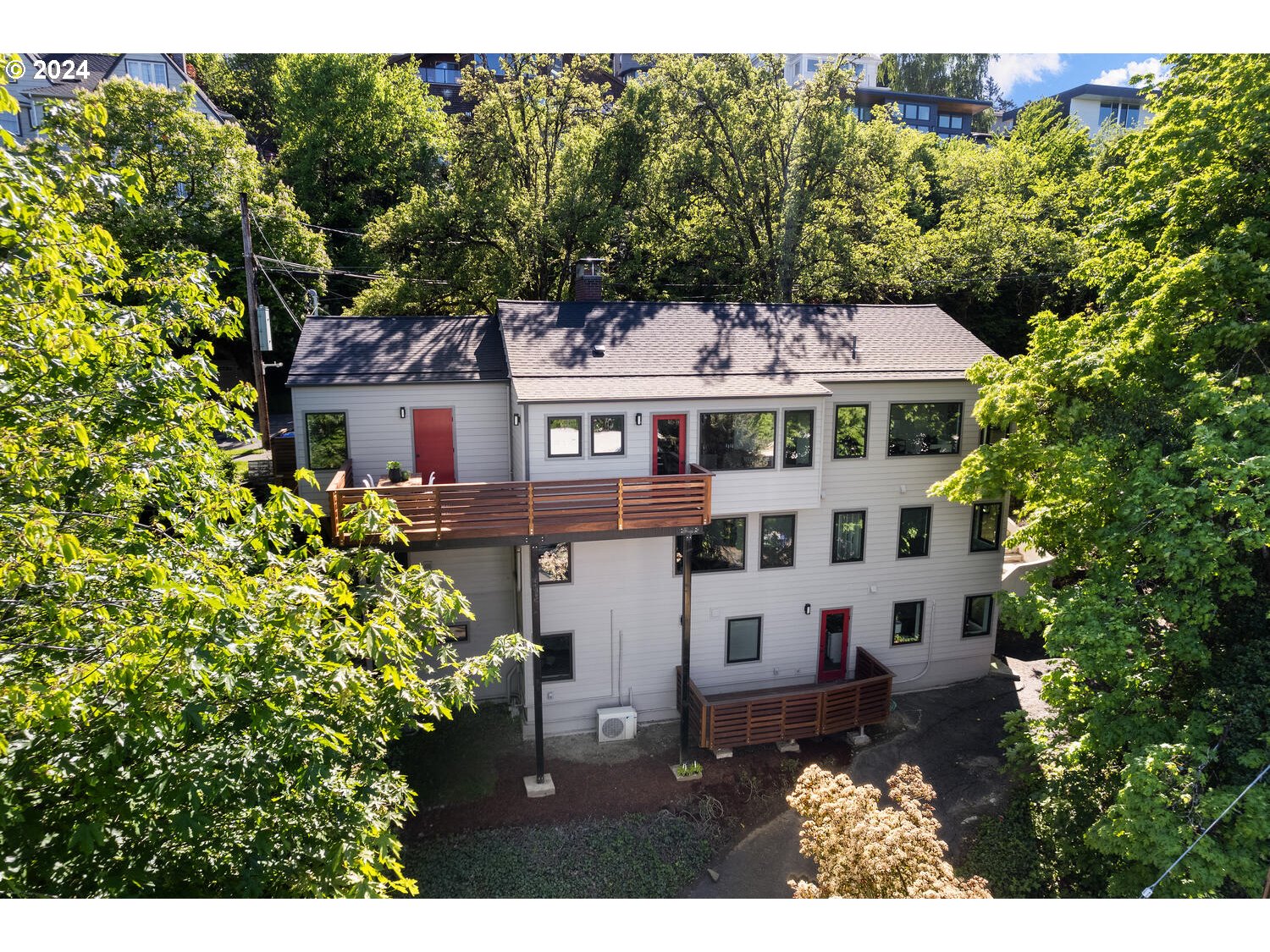 a aerial view of a house with a yard table and chairs