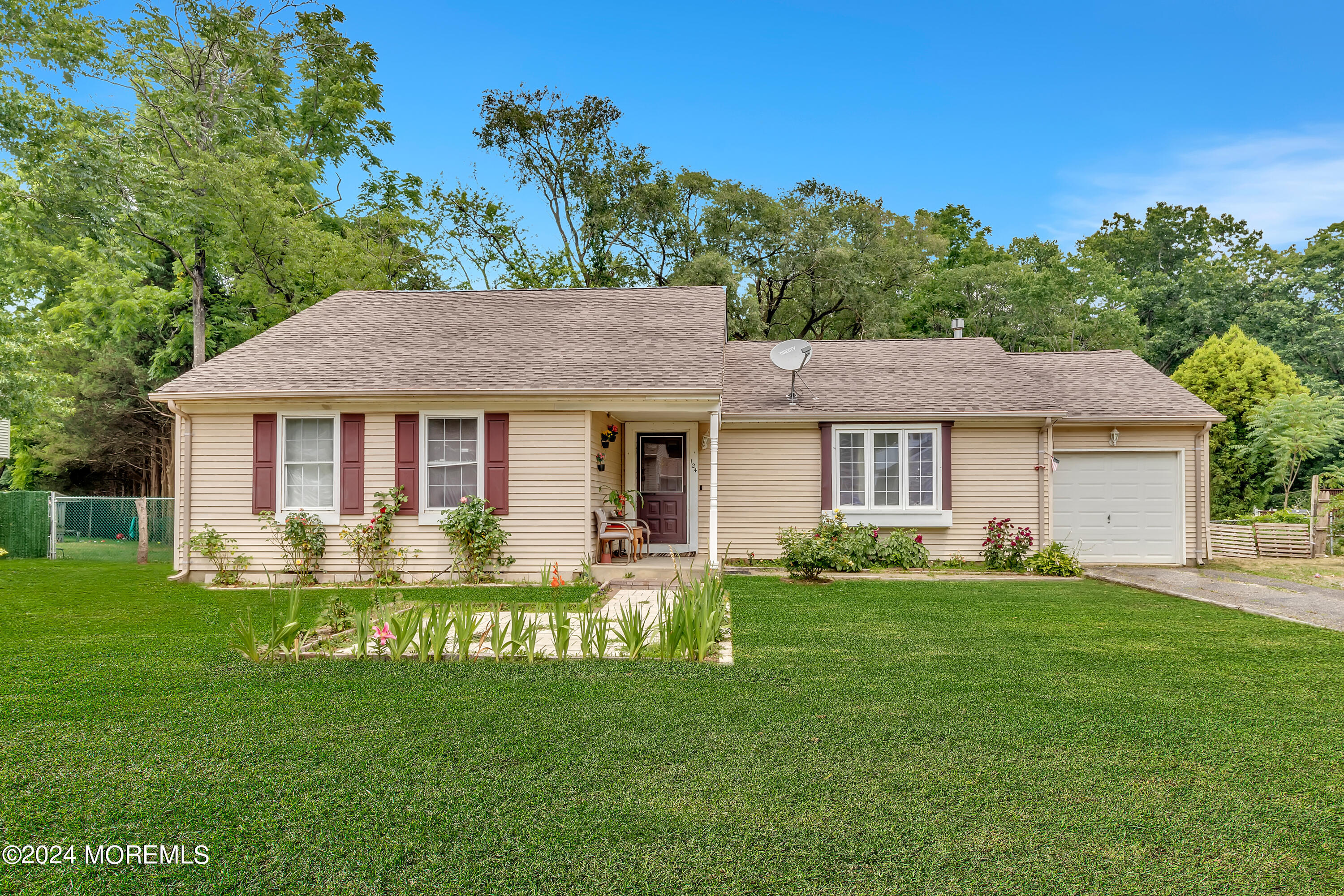 a front view of a house with a garden and porch