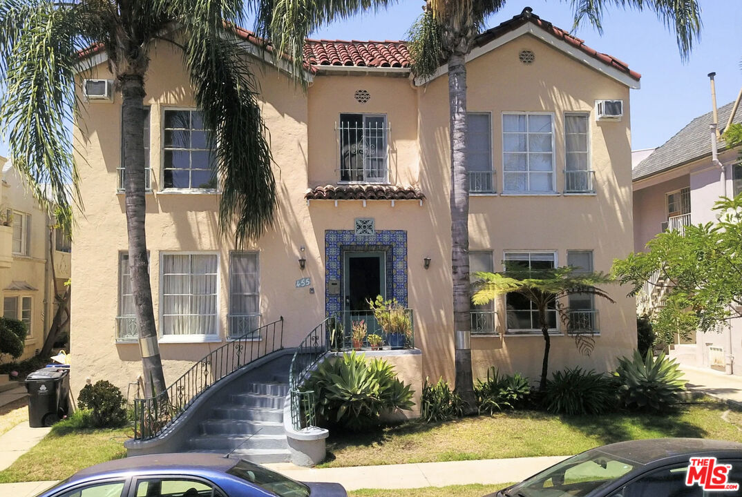 a front view of a house with garden