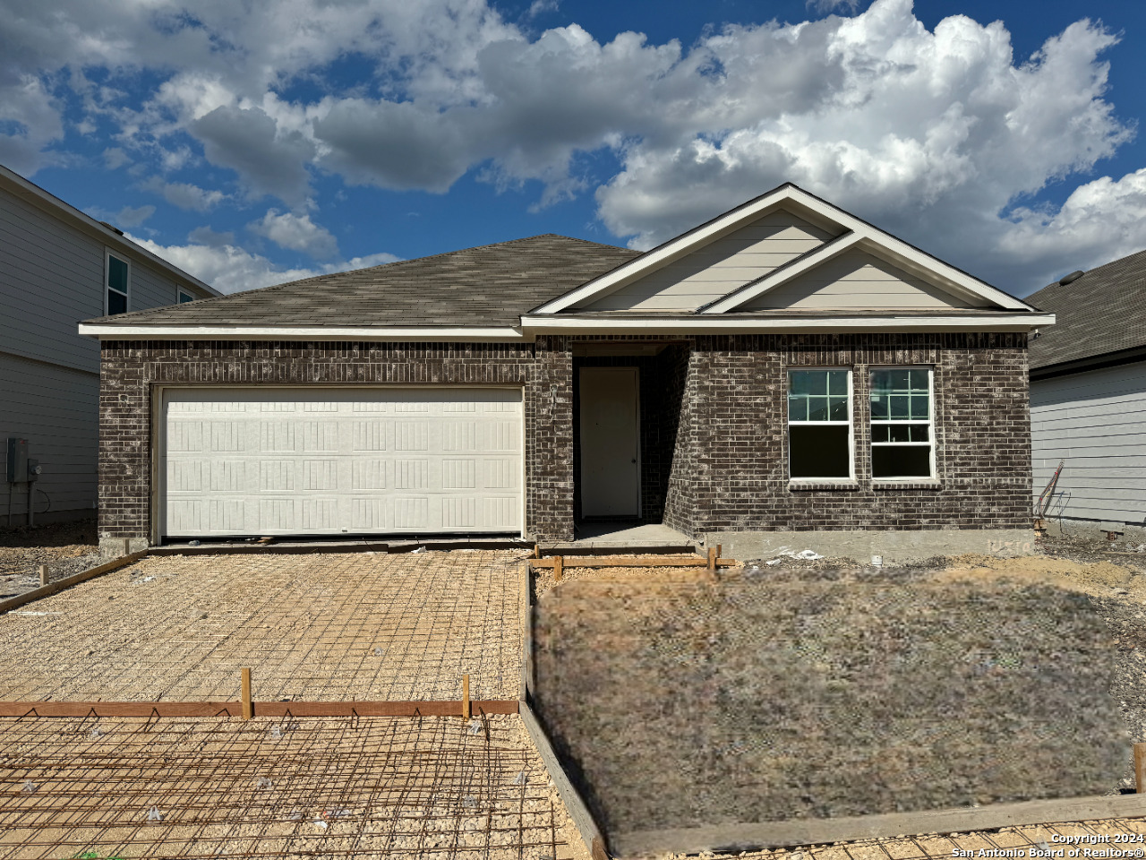 a front view of a house with yard