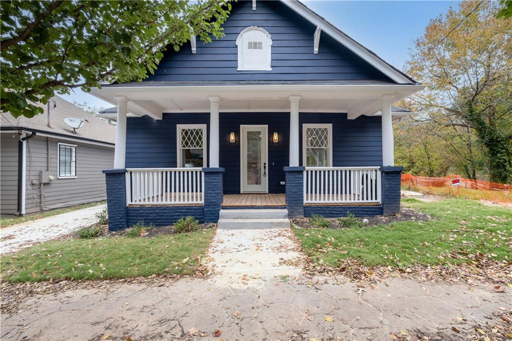 front view of a house with a yard