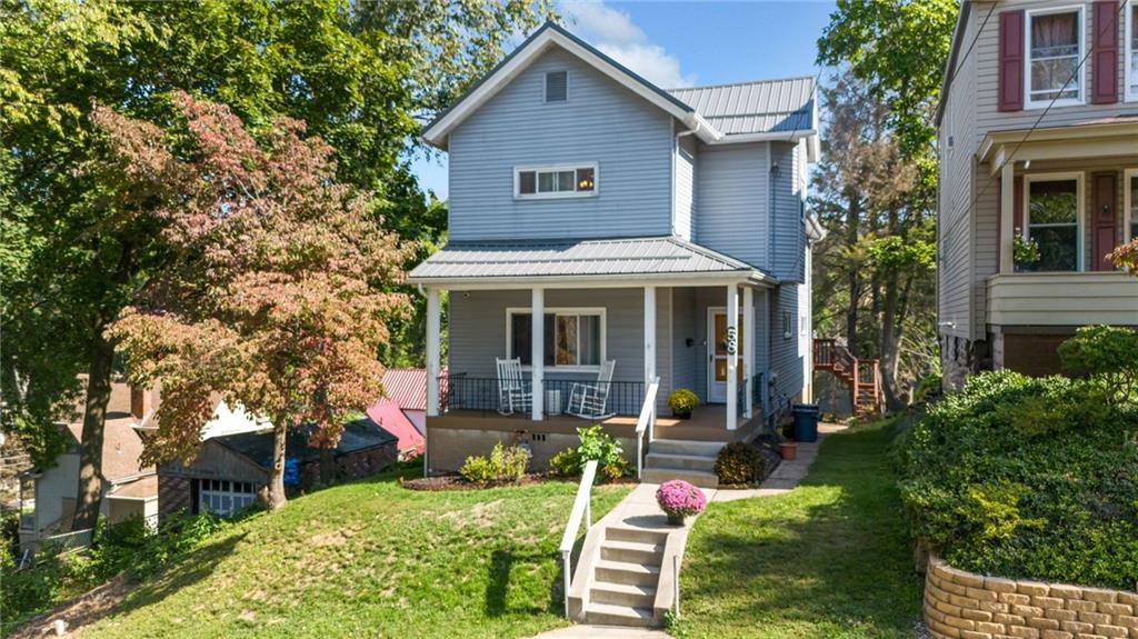 front view of a house with a yard