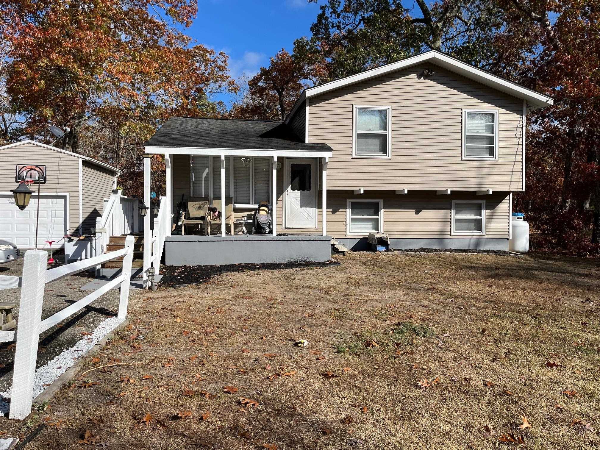 front view of a house with a yard