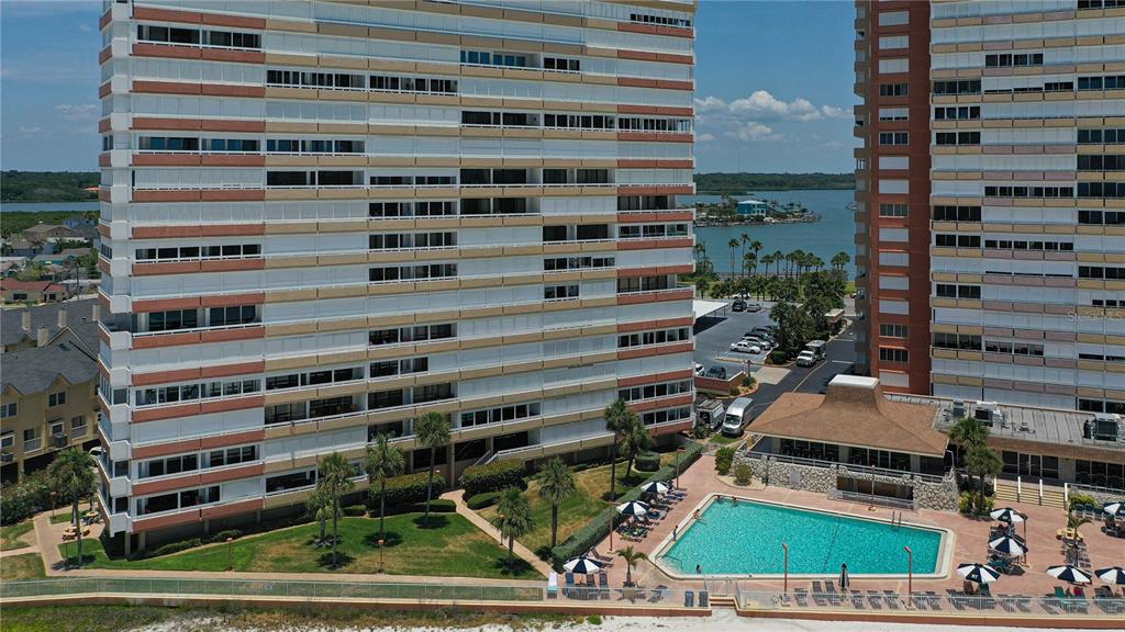 a view of a tall buildings and a yard