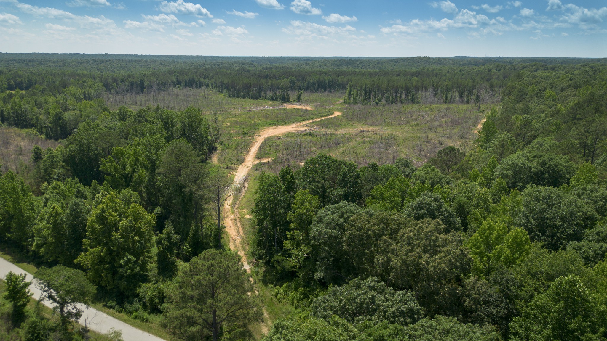 an aerial view of valley and lake