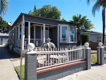 a view of house with a deck and furniture