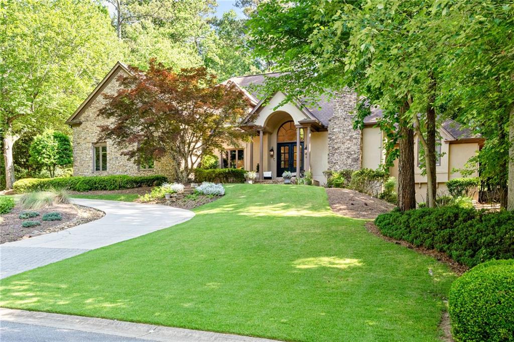 a front view of a house with a yard