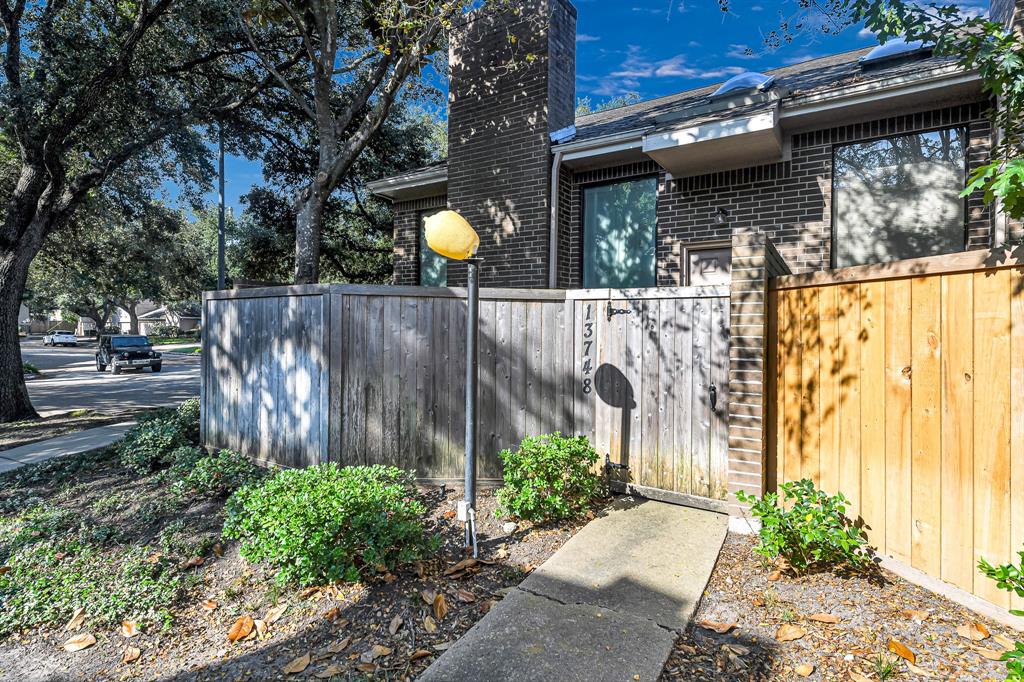 a view of outdoor space and front view of a house having yard