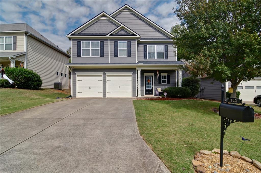 a front view of a house with a yard