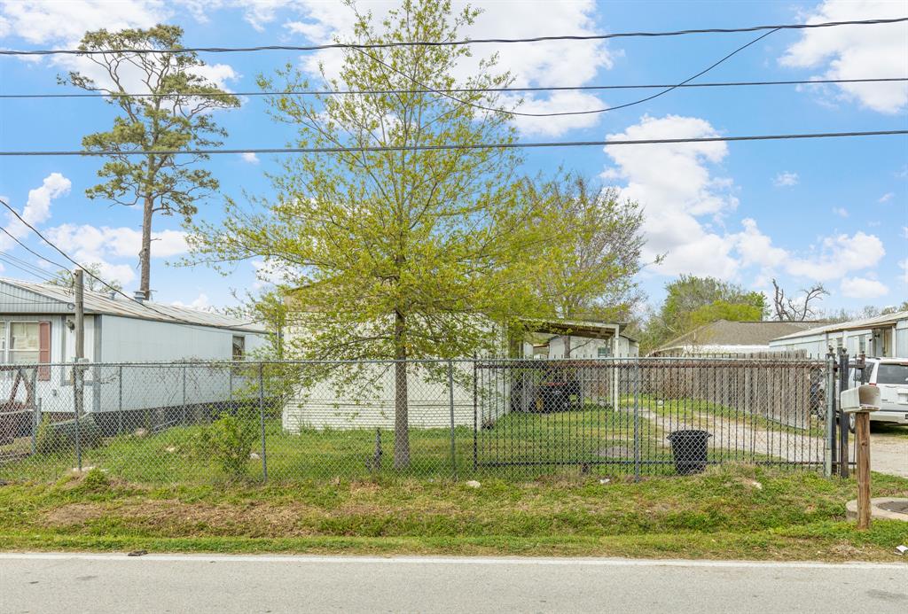 a view of a yard with a swimming pool