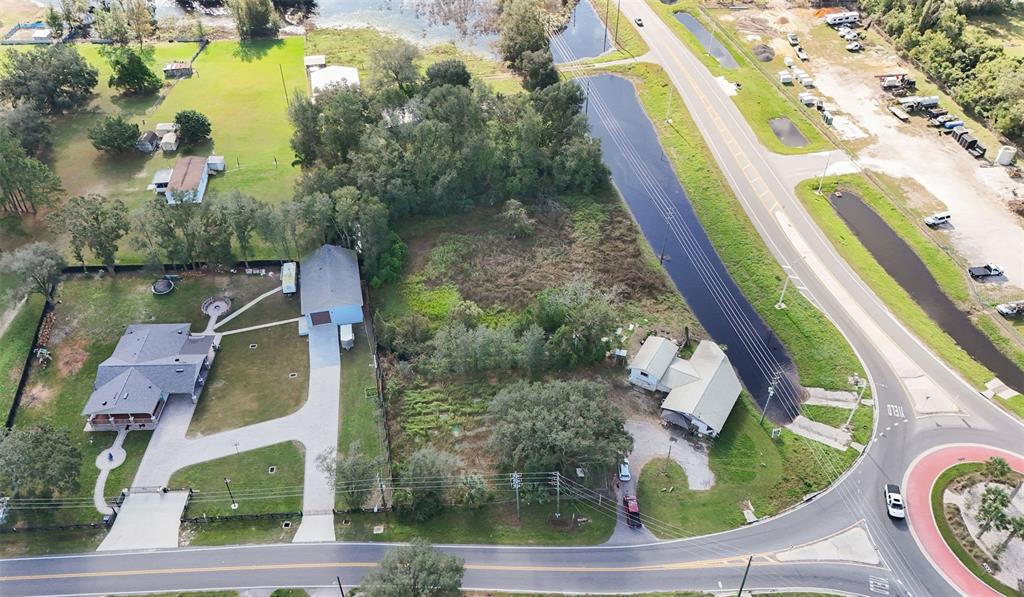 an aerial view of residential house with outdoor space and swimming pool