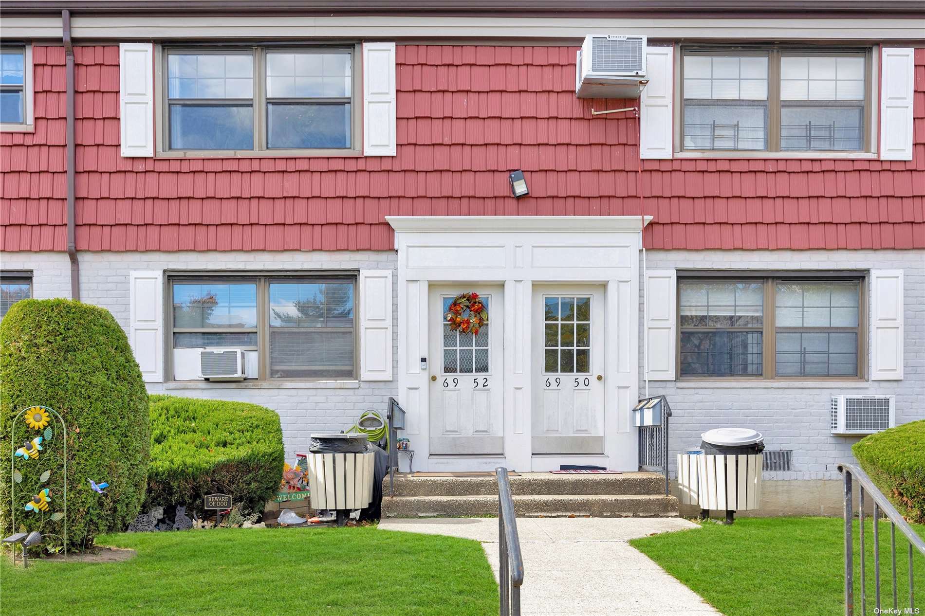 a front view of a house with garden